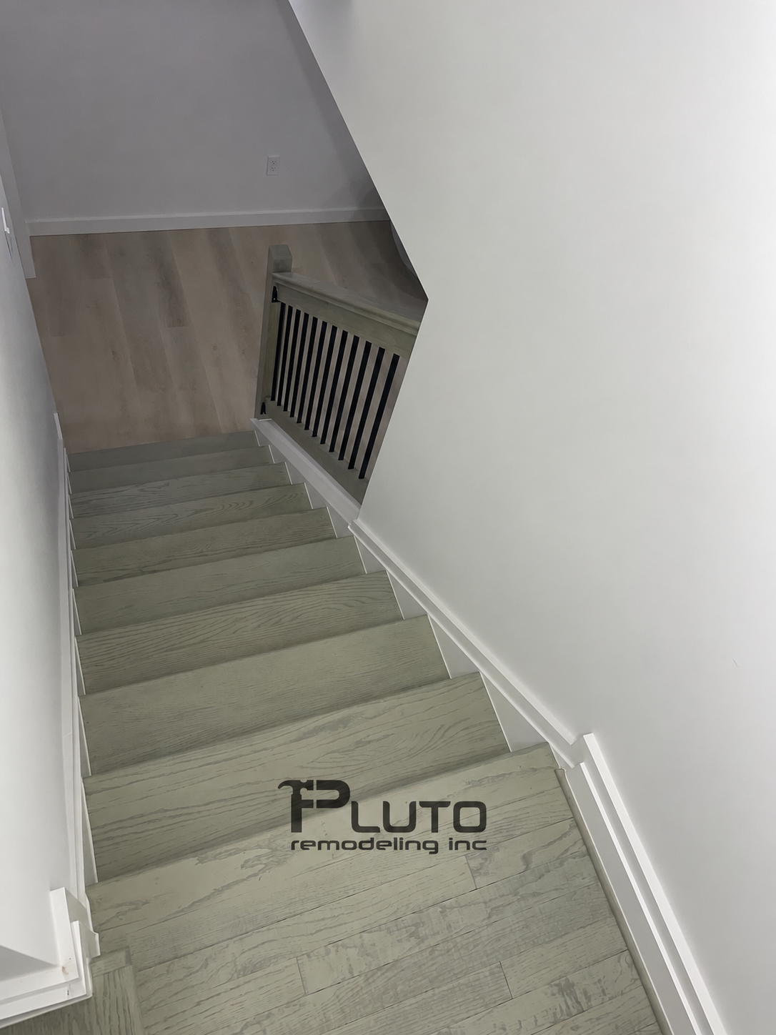 Finished staircase and railing — Pluto Remodeling