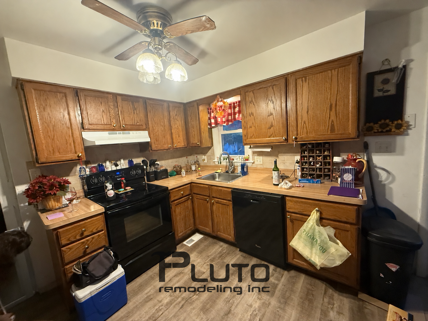 Before — existing cabinetry and layout — Pluto Remodeling