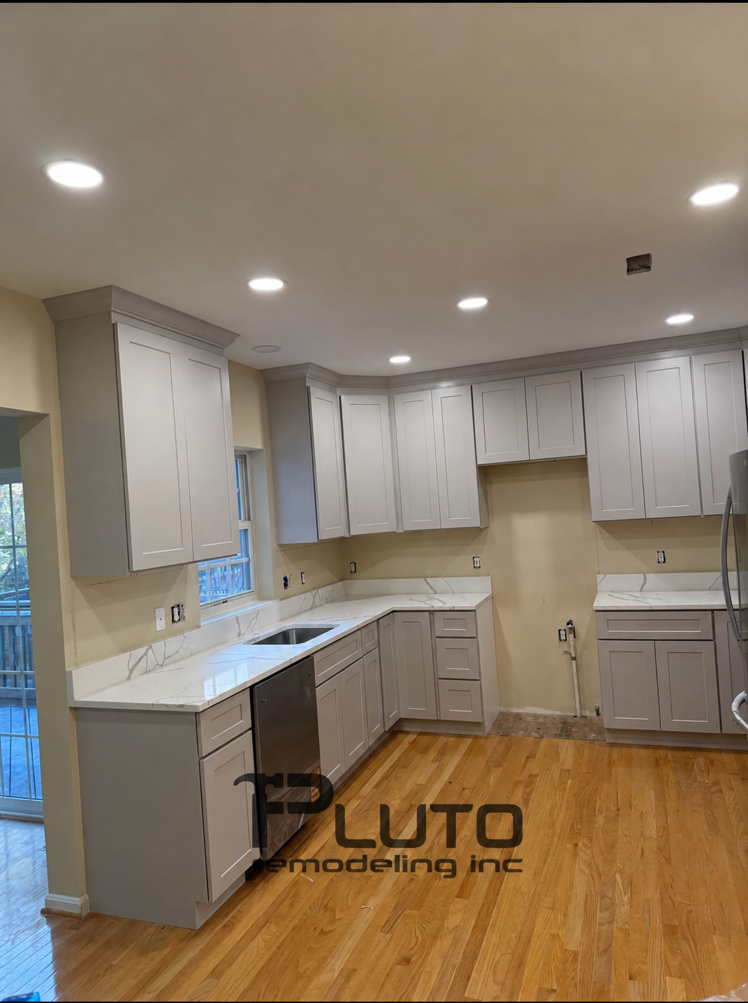 In progress — cabinet installation details — Pluto Remodeling