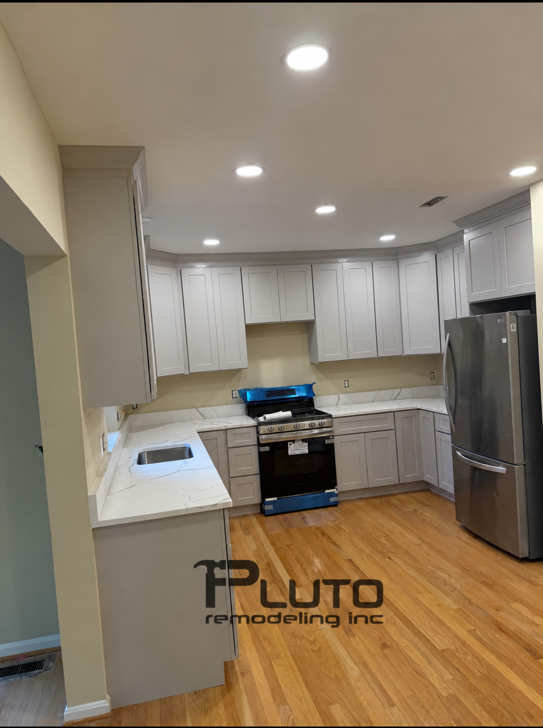 In progress — appliances, cabinets and countertops — Pluto Remodeling
