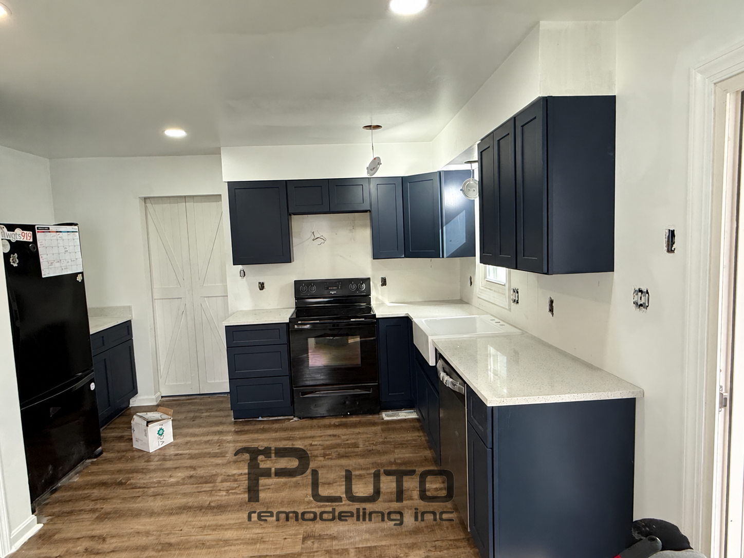 In progress — blue cabinets and countertop installation — Pluto Remodeling