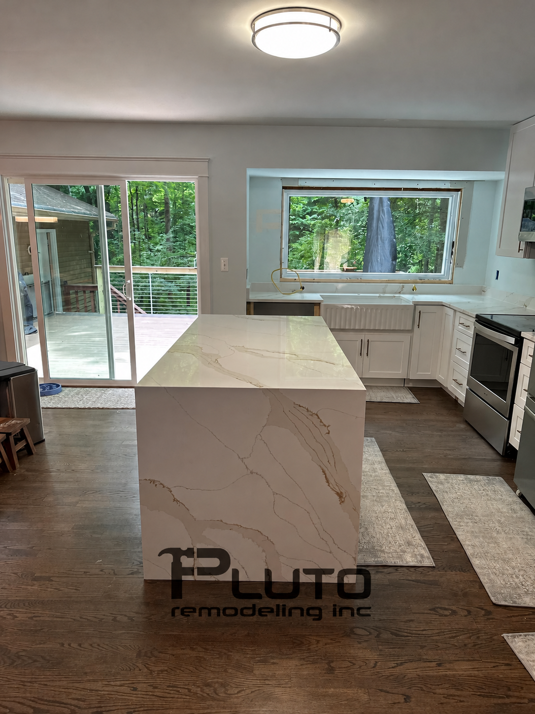 Kitchen island with waterfall countertop — installation progress — Pluto Remodeling